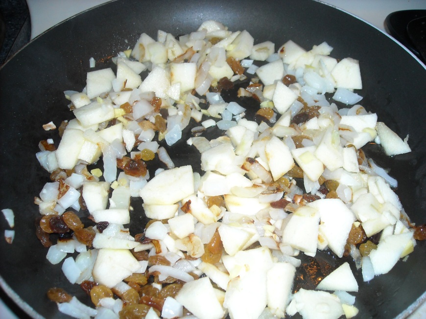 Sauteing onion, apple, raisins, garlic, and ginger 